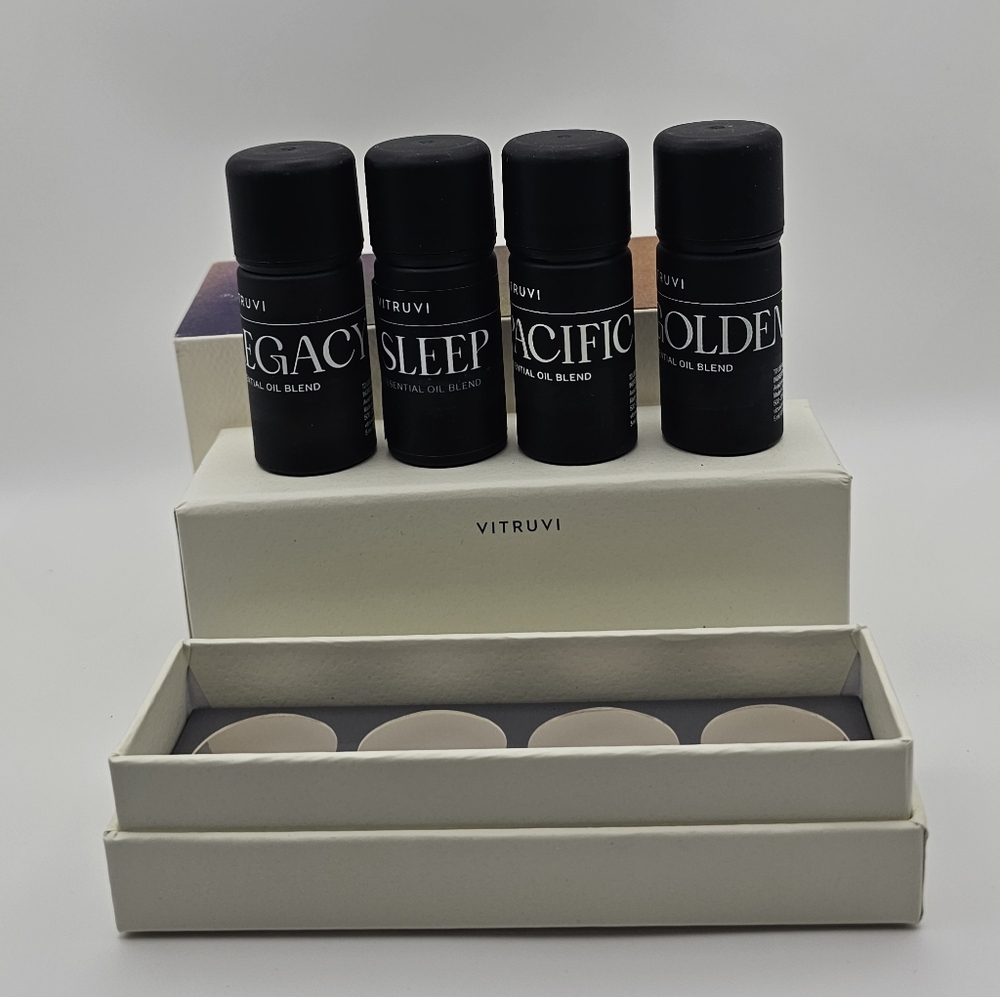 Vitruvi Signature Essential Oil Kit containing four distinct botanical blends